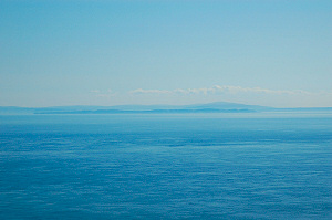 Picture of a view over the sea, land in the distance