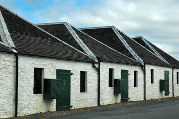 Picture of a row of whitewashed warehouses