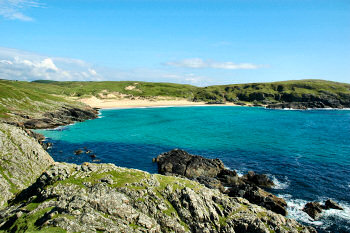 Picture of a beautiful sandy bay in brilliant sunshine (Lossit Bay, Islay)