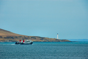 Picture of a ferry passing a lighthouse