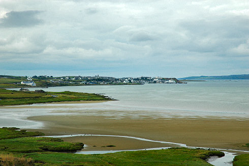 Picture of a view over a village (Bowmore, Isle of Islay) at the top of a sea loch (bay)