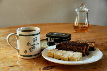 Picture of shortbread, Islay loaf, tea, Islay Single Malt, a cup of tea and smouldering peat cones