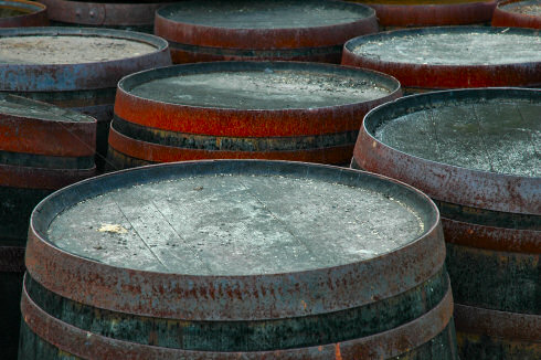 Picture of some old casks with rusty metal bands