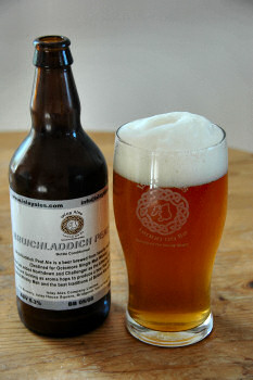 Picture of a bottle and pint of Bruichladdich Peat Ale by Islay Ales