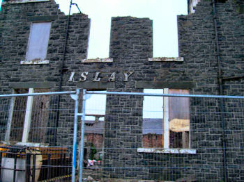 Picture of the wall of a building being demolished