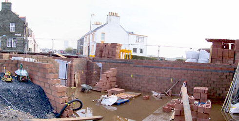 Picture of a panoramic view over a building site partly 'flooded' after a lot of rain