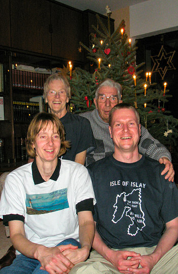 Picture of the Grewe family in front of the Christmas tree