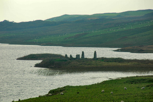 Picture of ruins of buildings on an island in a loch (lake)