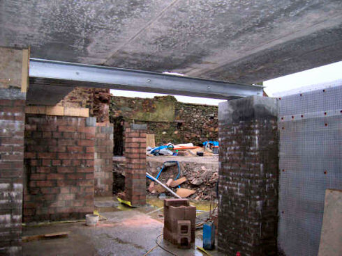 Picture of a view towards an opening in a basement under construction