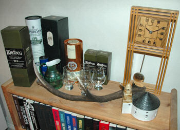 Picture of a shelf with various Islay related things