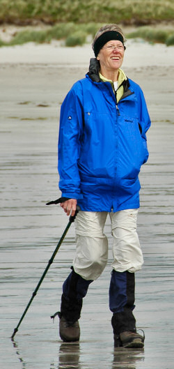 Picture of a woman in walking gear on a beach