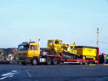 Picture of a low loader lorry with drilling equipment