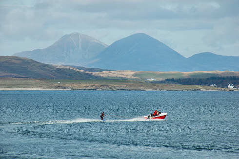 Picture of waterskiing on a sea loch on Islay. The Paps of Jura in the background.