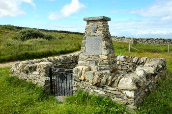Picture of a stone memorial surrounded by a stone wall