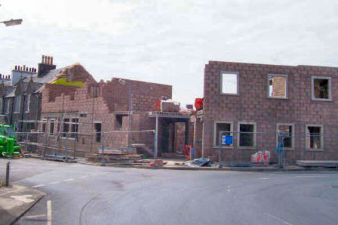 Picture of the front of a hotel under construction