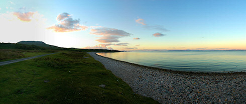 Picture of a beautiful bay with a pebble beach in the late evening sun