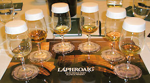 Picture of 6 glasses of whisky on a mat for whisky tasting
