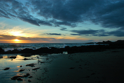 Picture of a sunset under a partly cloudy sky