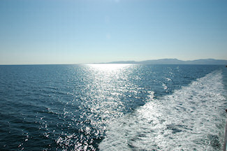 Picture of an island in beautiful sunshine seen from a ferry