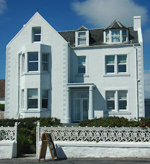 Picture of a small hotel in a white painted beautiful house