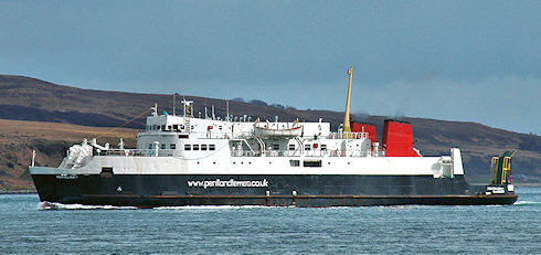 Picture of a ferry going along a sound between two islands