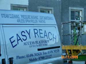 Picture of the side of a van with the Easy Reach company information