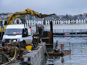 Small picture of workmen busy on a quay wall