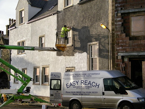 Picture of a hotel under construction being painted