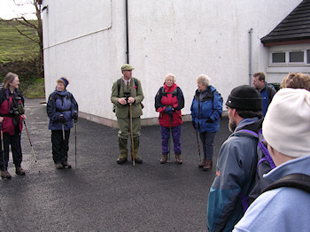 Picture of a gamekeeper welcoming walkers for a walk