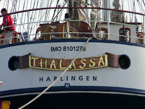 The stern of a ship with the name Thalassa