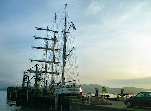 Picture of a tall ship at a pier in the evening light