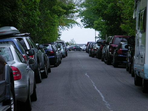 Picture of a road full of parked cars