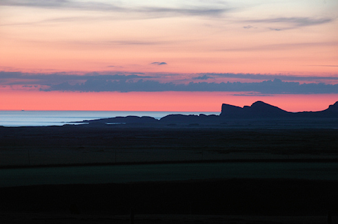 Picture of some distinctively shaped rocks under a colourful sky