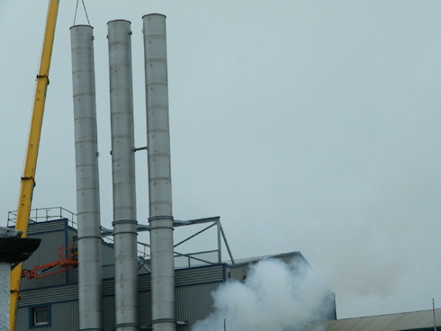 Picture of three metal chimneys at a maltings (closer view)