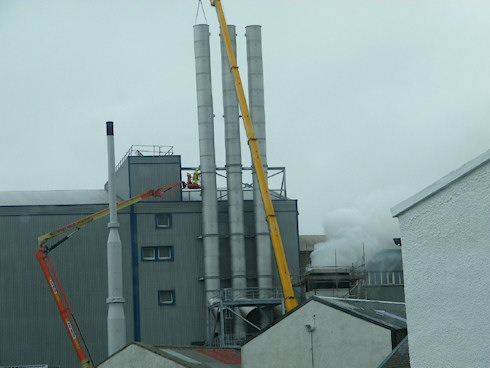 Picture of three chimneys being installed at the Port Ellen maltings on Islay