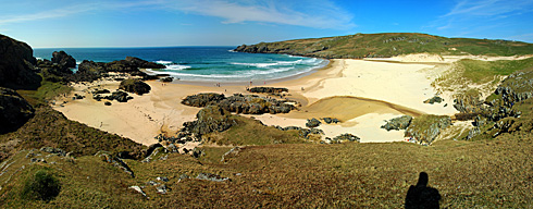 Picture of a panoramic view over a sandy bay and beach on a sunny day