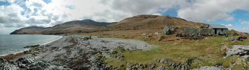 Panoramic view of a shoreline with a bothy, An Cladach on Islay