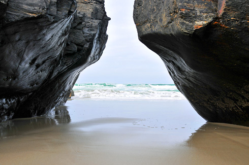 What I believe to be a collapsed natural arch near Sanaigmore Picture of a collapsed natural above a sandy ground
