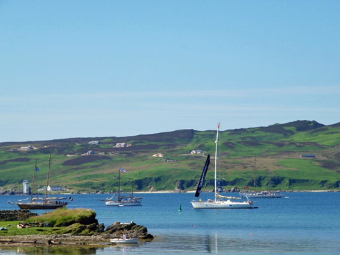 View into the bay with anchored ships and yachts Picture of a bay with some tall ships and yachts