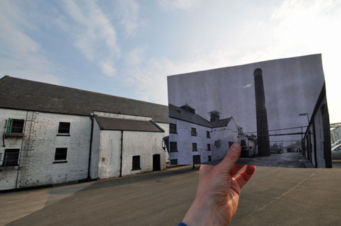 Picture of a picture within a picture, old within new, of the yard at Laphroaig distillery