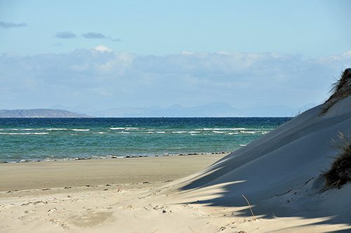 Picture of a view around dunes across the sea to other islands