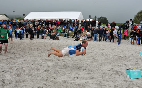 Picture of a flying try at the Islay beach rugby tournament