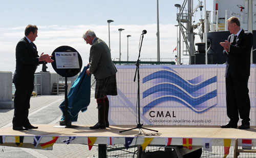 Grenville Johnston revealing the plaque and officially declaring Port Ellen pier open for business Picture of a man revealing a plaque
