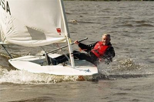 Picture of a man sailing a Laser dinghy