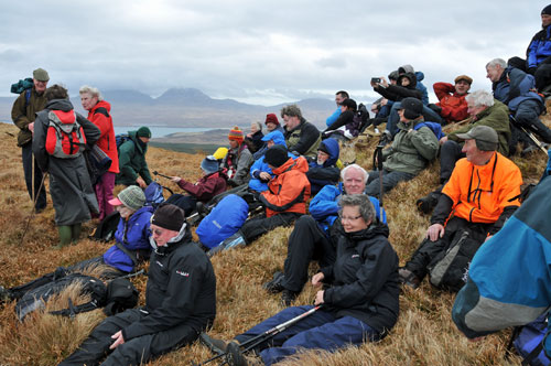 Picture of a group of walkers at a summit cairn