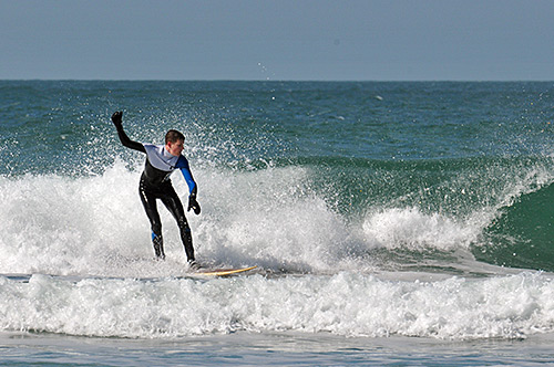 Picture of a surfer riding a wave