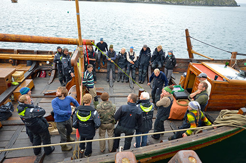 Picture of the crew of a replica Viking ship on deck