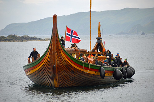 Picture of a viking ship replica arriving in a harbour