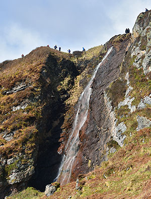 Picture of walkers above a waterfall