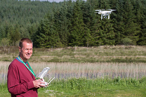 Picture of Armin Grewe flying a DJI Phantom 3 quadcopter